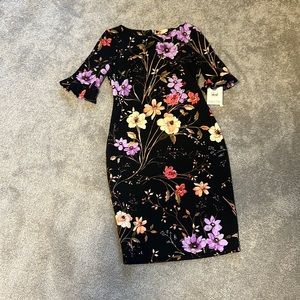 New with tag. Calvin Klein black and floral women’s dress size 6.